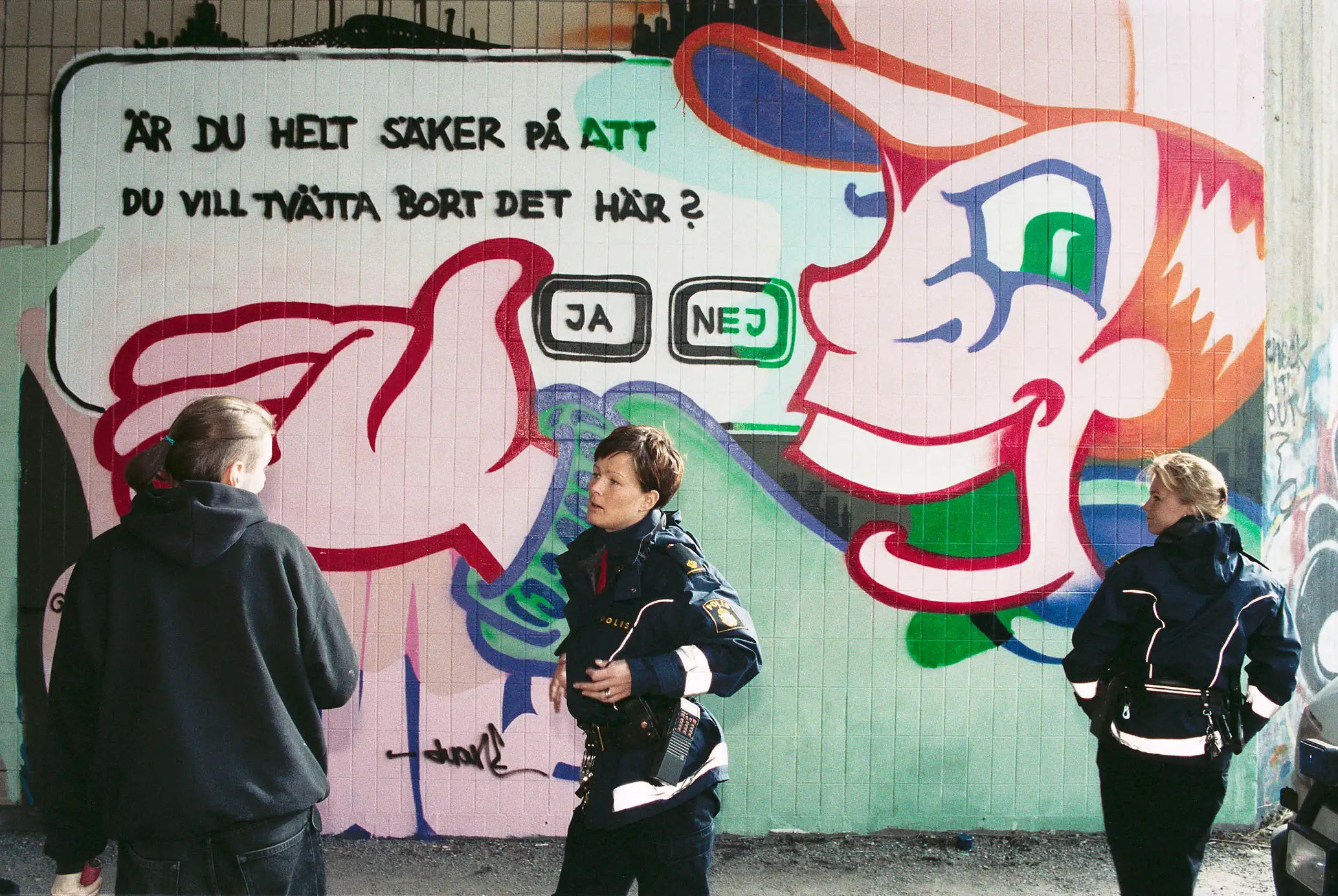Police at a painted mural, Nacka