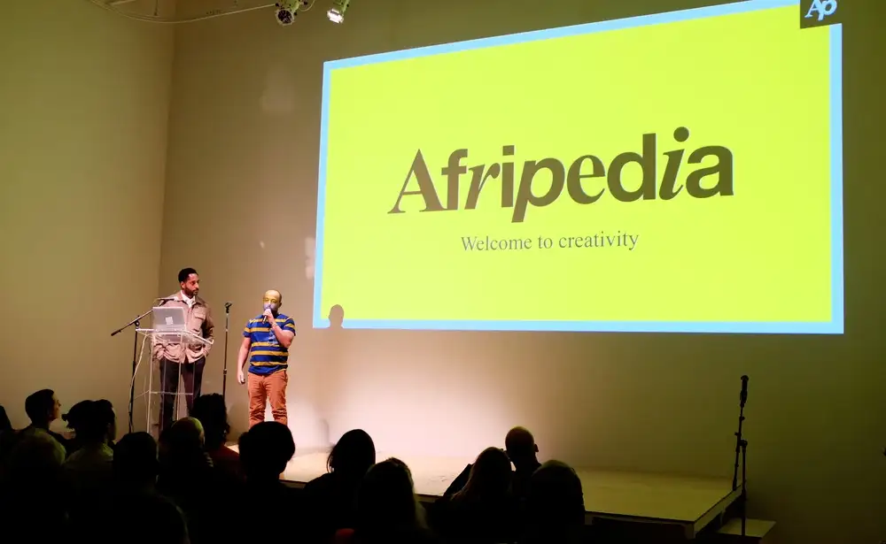 Afripedia launch presentation on stage, "Welcome to creativity"